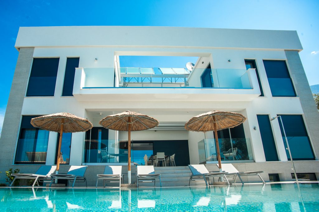 Villa Azzurro exterior with balconies overlooking the pool, Kefalonia