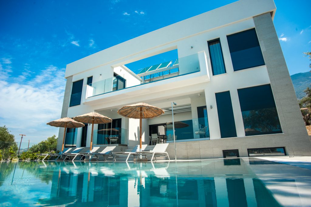 Villa Azzurro modern exterior with pool and olive trees, Kefalonia