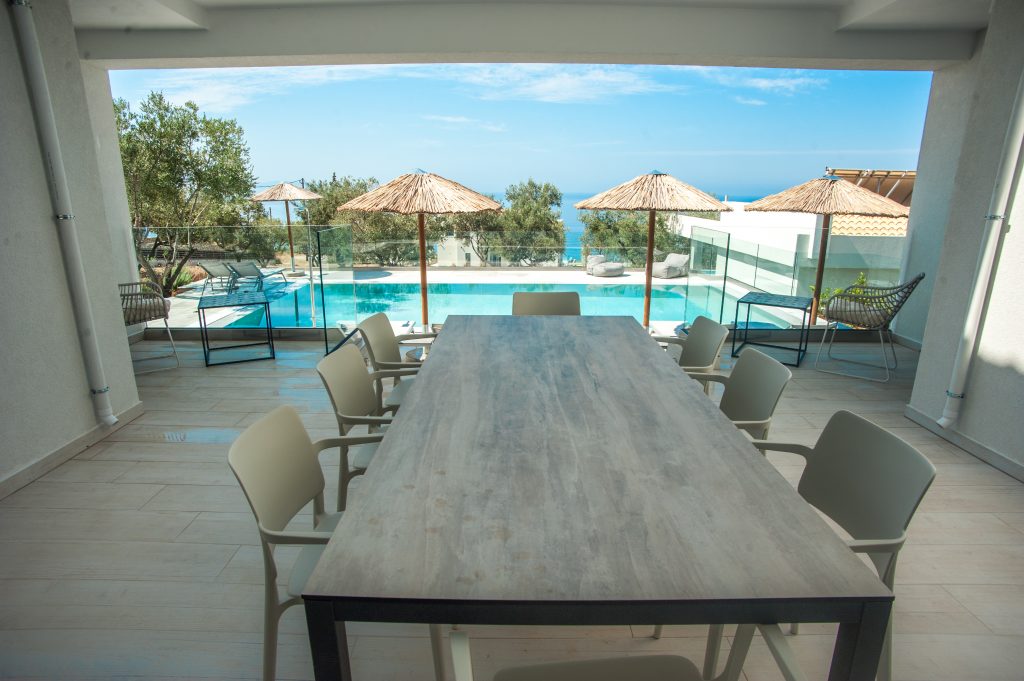 Villa Azzurro covered outdoor dining terrace with pool view, Kefalonia