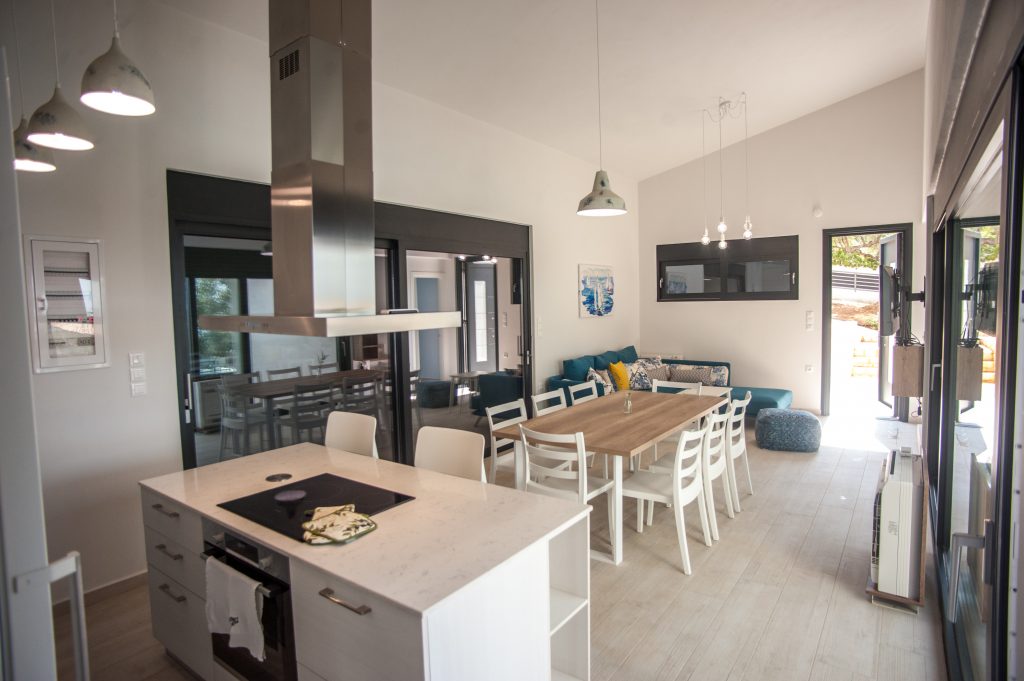 Villa Azzurro open-plan kitchen and dining area with exposed beams, Kefalonia