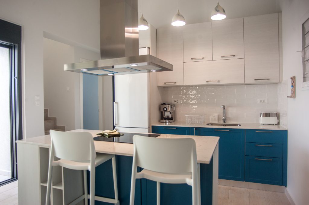 Villa Azzurro kitchen with island seating and blue cabinetry, Kefalonia