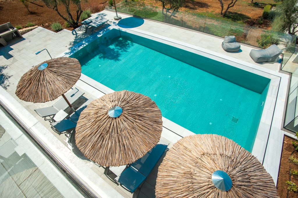 Villa Azzurro pool and terrace from above with umbrellas, Kefalonia