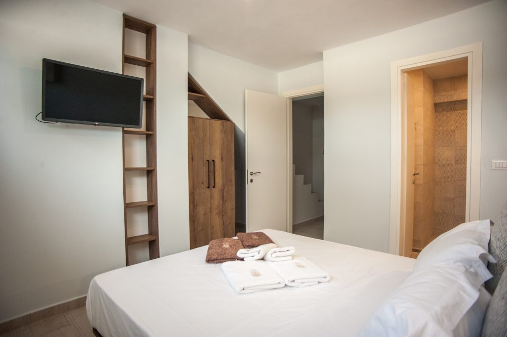 Villa Azzurro bedroom with open wardrobe and en-suite access, Kefalonia