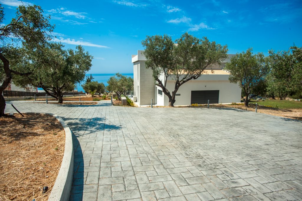 Villa Azzurro landscaped grounds with olive trees and sea glimpses, Kefalonia