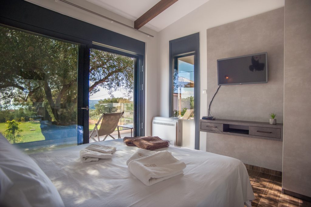 Villa Carisma bedroom with garden view and terrace doors, Kefalonia