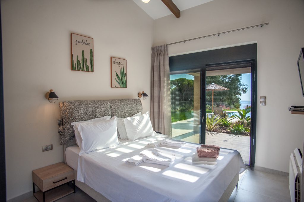 Bedroom with garden-view terrace and colourful cushions, Villa Arte, Kefalonia