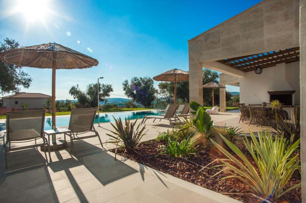 Poolside terrace in evening light, Villa Arte, Kefalonia