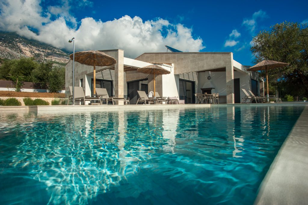 Villa Carisma infinity pool with villa and mountain backdrop, Kefalonia