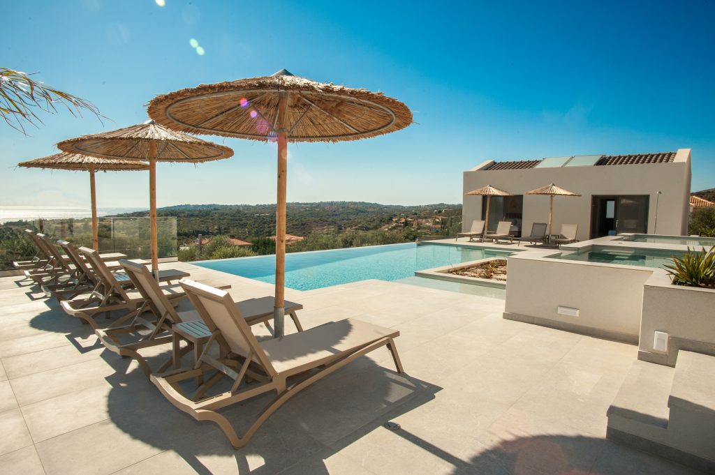 Villa Insieme pool terrace with umbrellas and sea views, Kefalonia