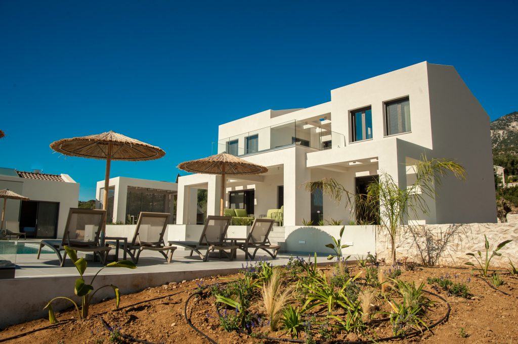Villa Insieme two-building exterior with poolside landscaping, Kefalonia