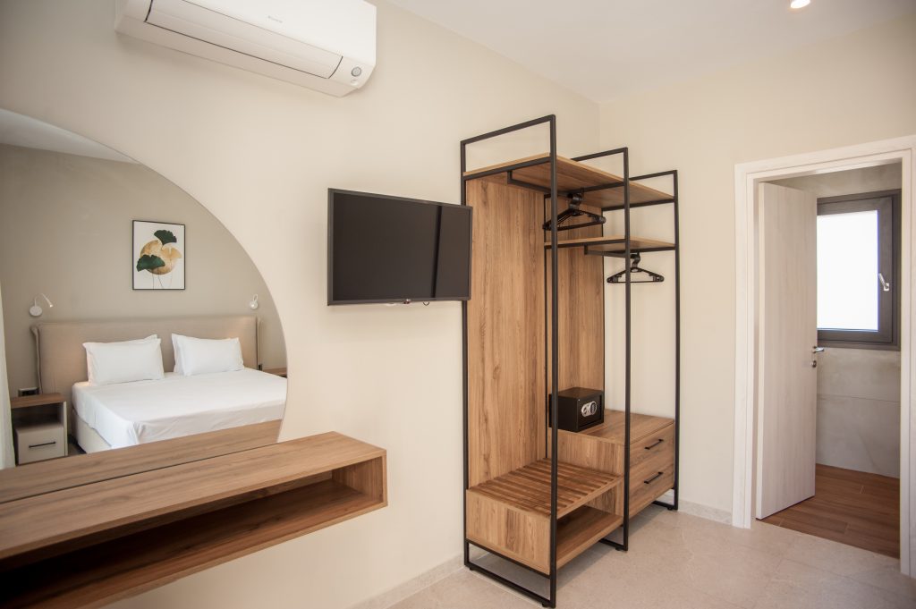 Villa Insieme bedroom with fitted wardrobe and en-suite access, Kefalonia