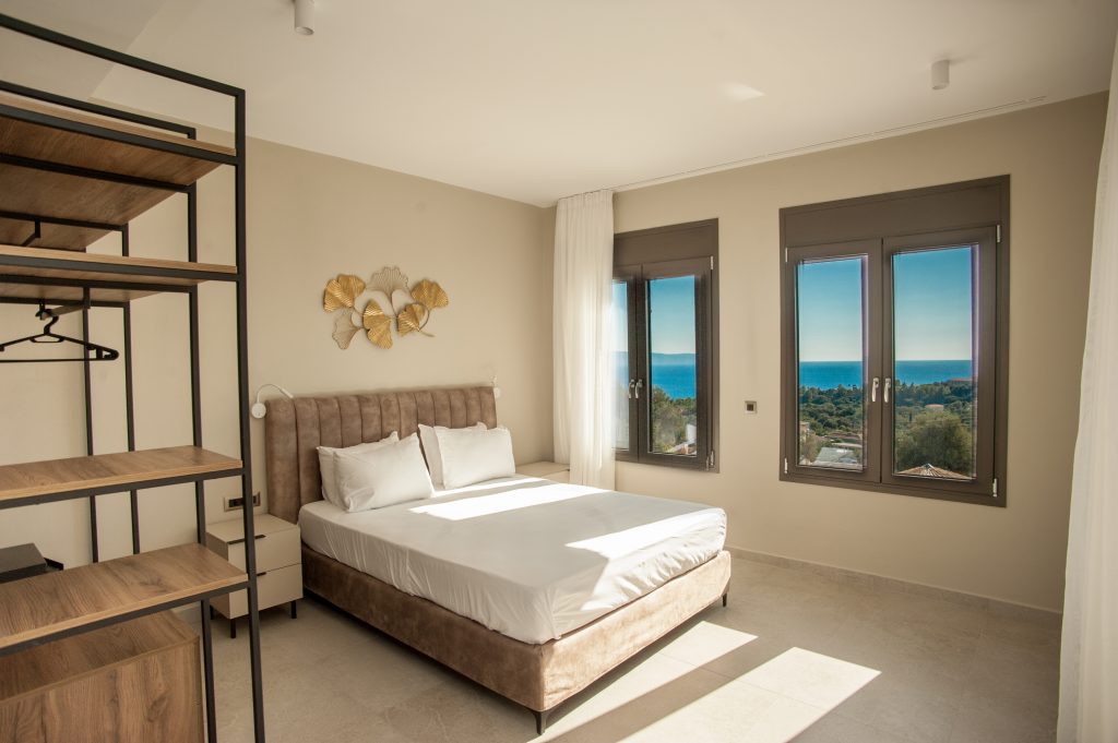 Villa Insieme bedroom with sea views and open wardrobe, Kefalonia
