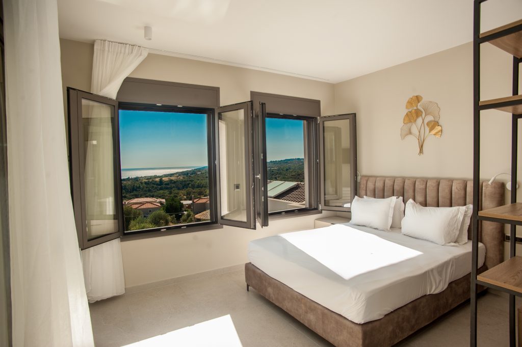 Villa Insieme bedroom with open sea-view windows, Kefalonia