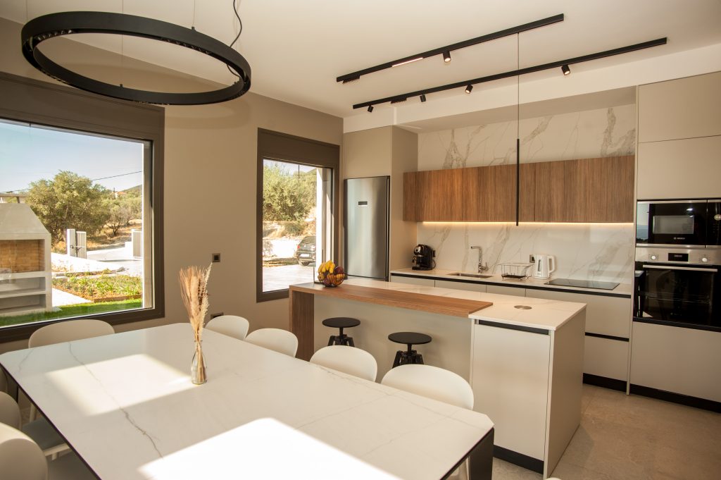 Villa Insieme kitchen and dining area with statement lighting, Kefalonia