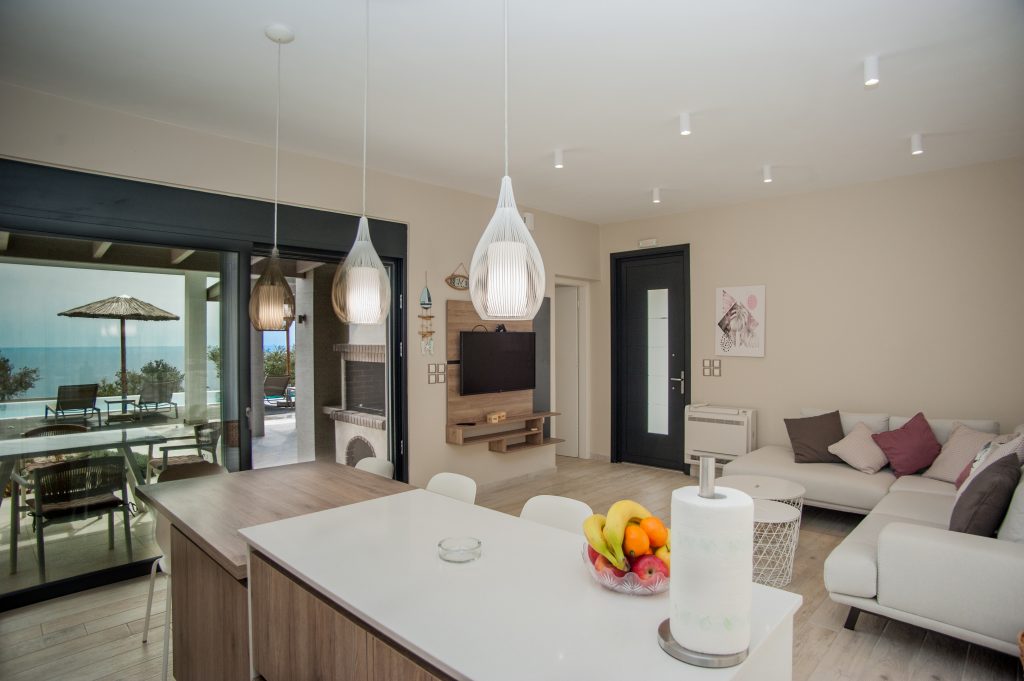 Villa Bambola living and dining area opening onto the sea-view terrace, Kefalonia