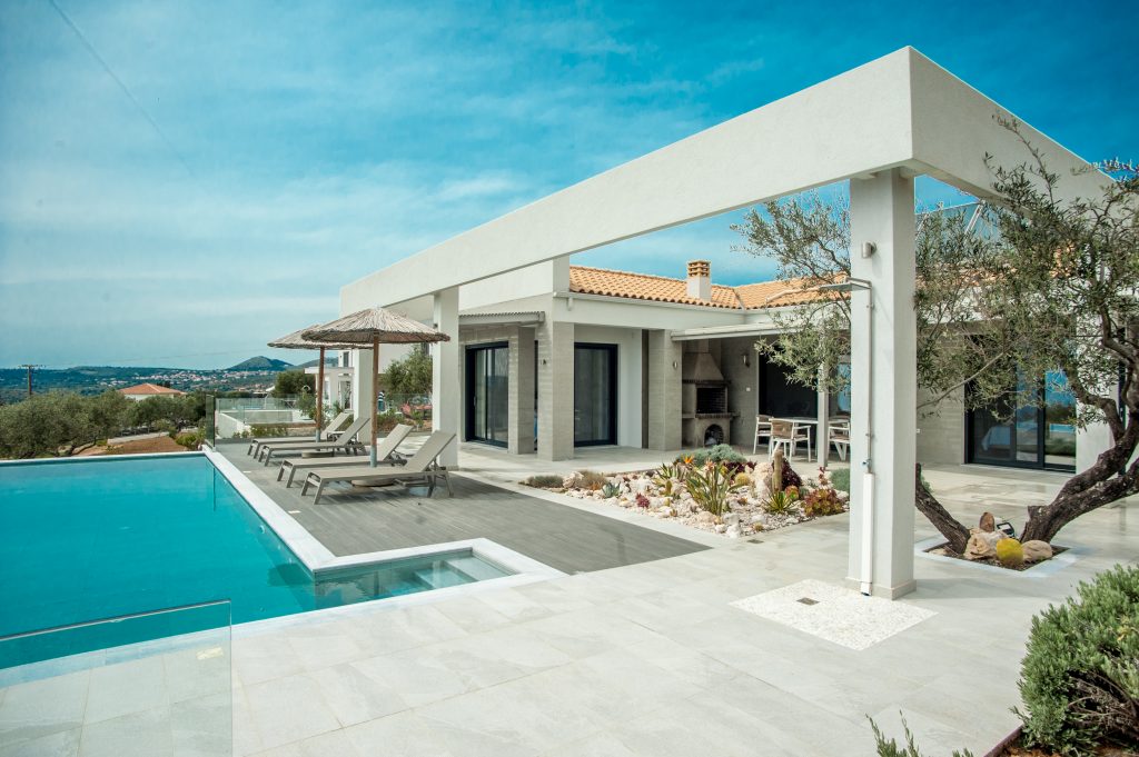 Villa Bambola pool and covered terrace with sea views and olive trees, Kefalonia